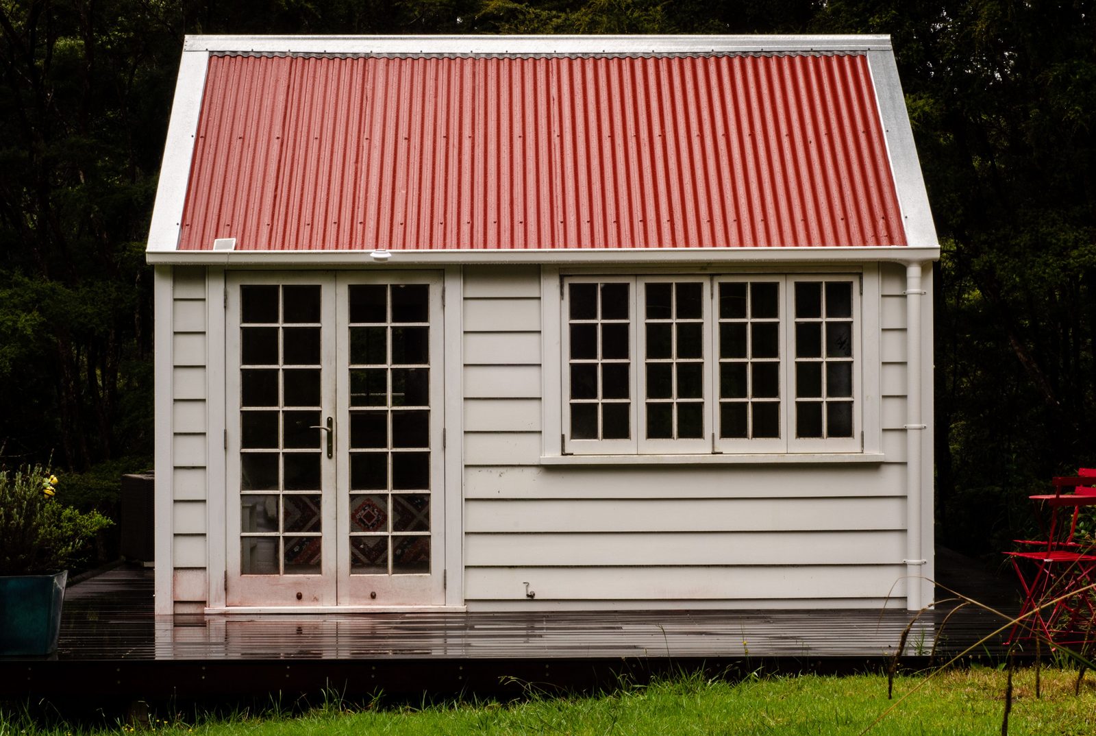 New red corrugated metal roof after replacement