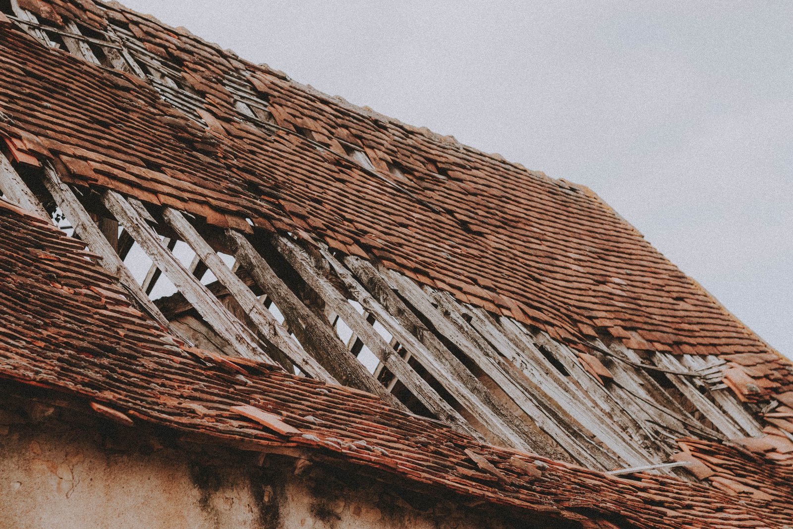Slipped and leaking roof tiles before replacement